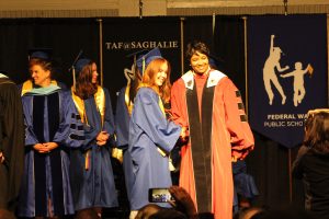 Bailee O'Connell receives her high school diploma.