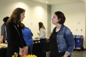 Volunteer Ann chats with Integration Program Manager Denise