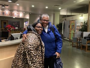 Trish and Sherry, Executive Director of Operations, embrace after partnership victory