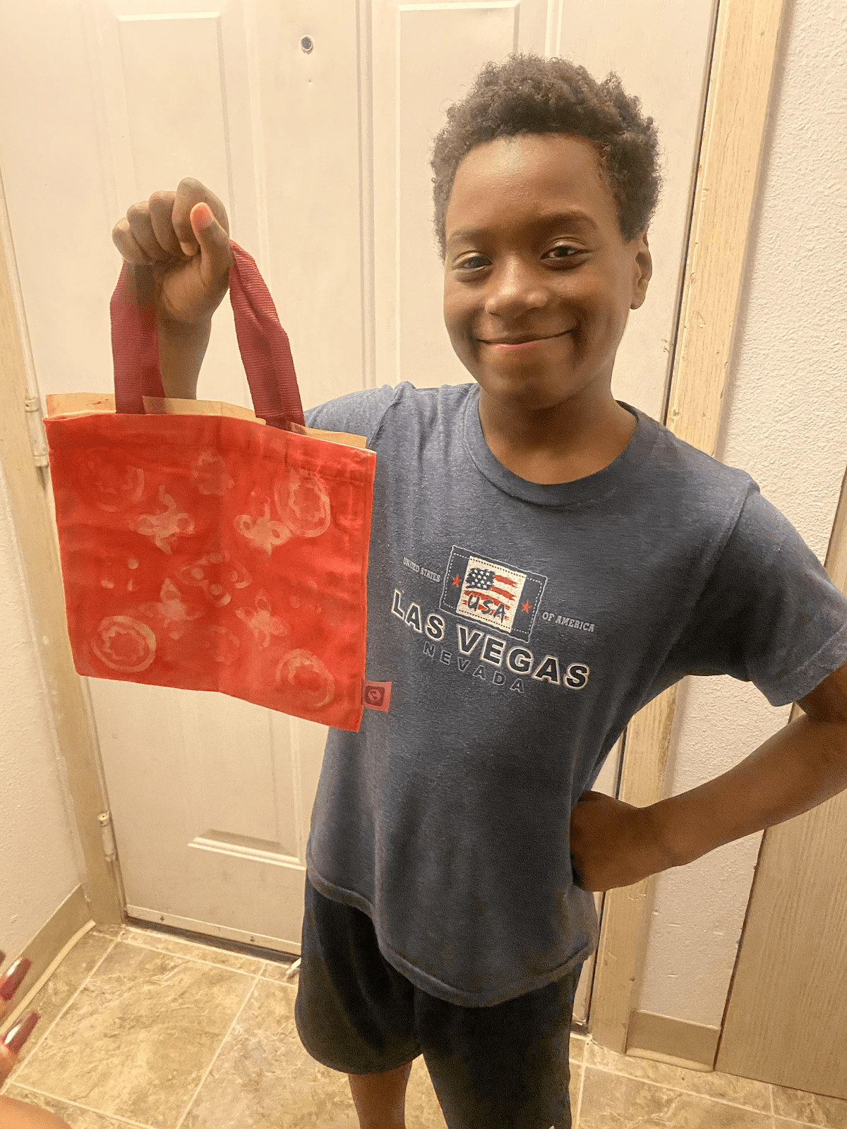 TAF@Saghalie Virtual Jumpstart student holds up a creation from his STEM kit.