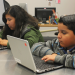 Students working on laptops